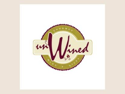 A round gold badge with the word unWined in burgundy script