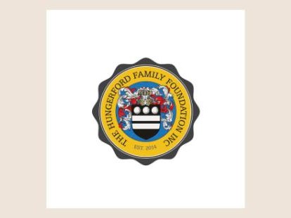 A round gold and navy seal with a family crest